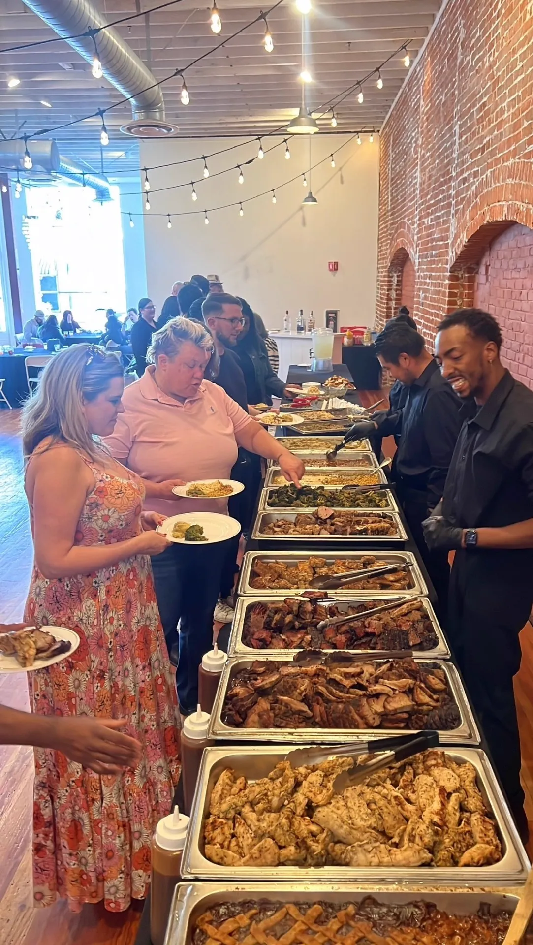 Restaurant-quality buffet line at a Qfire Catering corporate dinner across Phoenix and San Diego