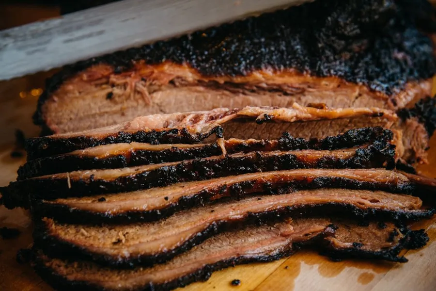 Smoked sliced beef brisket with a dark bark