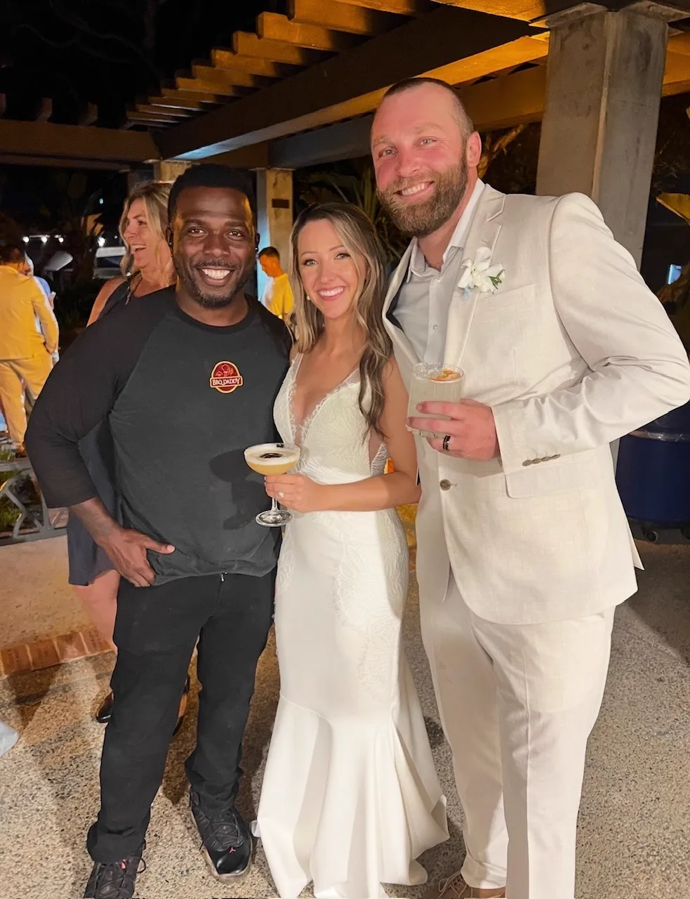 Chef Terry with bride and groom at an outdoor destination reception — Qfire Catering