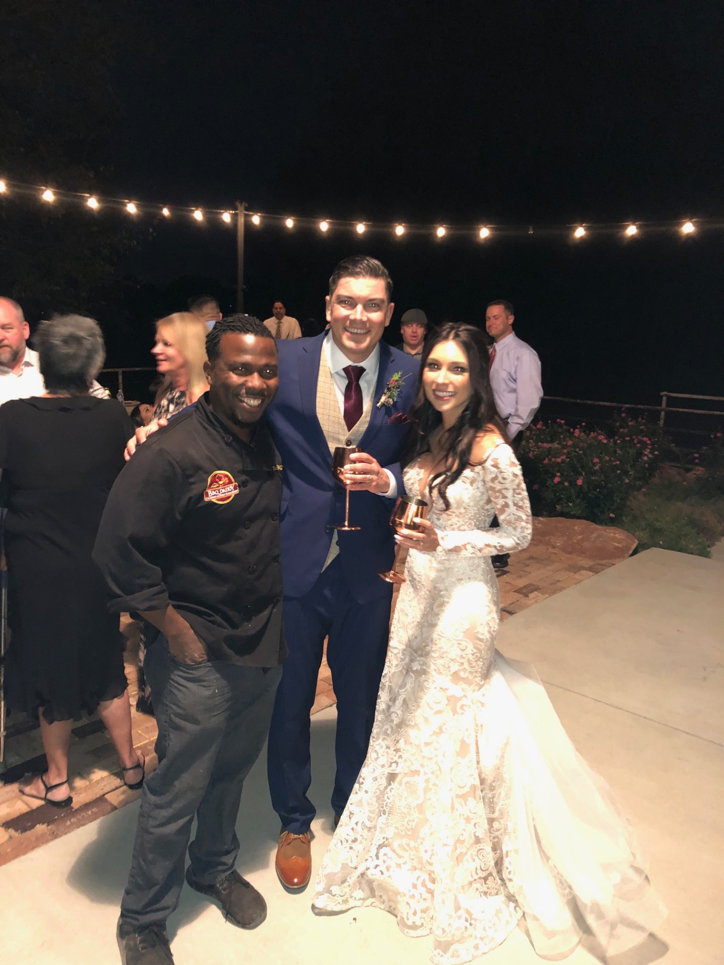 The BBQ Daddy with newlywed couple at Scottsdale wedding reception