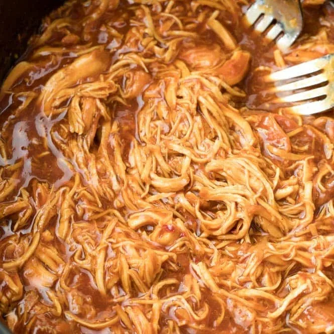 Smoked BBQ pulled chicken in a serving pan