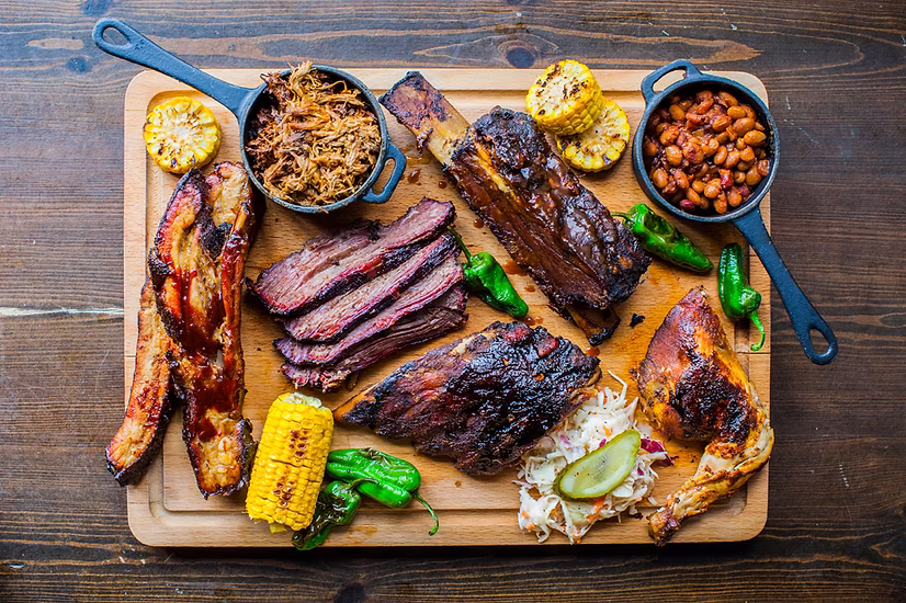 Wood-Fired BBQ catering platter — Texas-style brisket, pulled pork and smoked sausage by Chef Terry Matthews of Qfire Catering