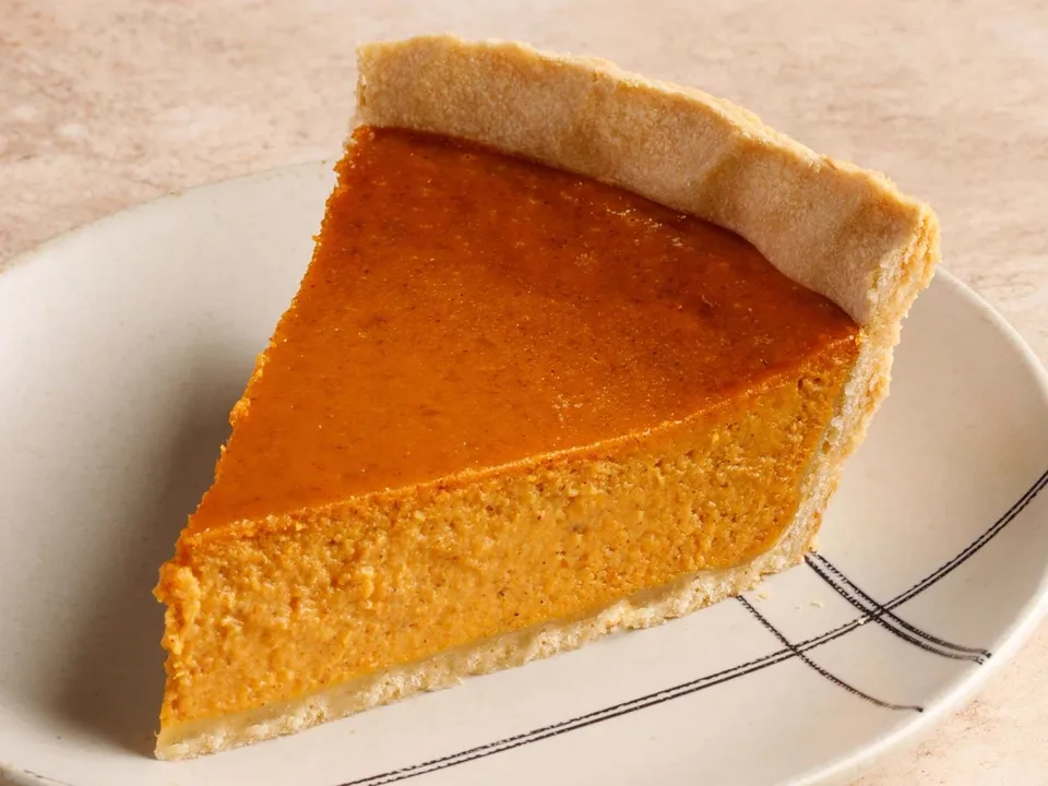 Pumpkin pie slice with whipped cream