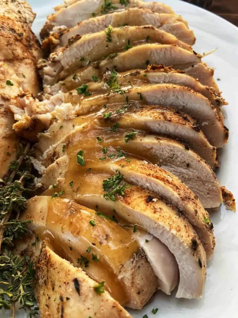 Smoked sliced turkey breast with gravy for holiday catering